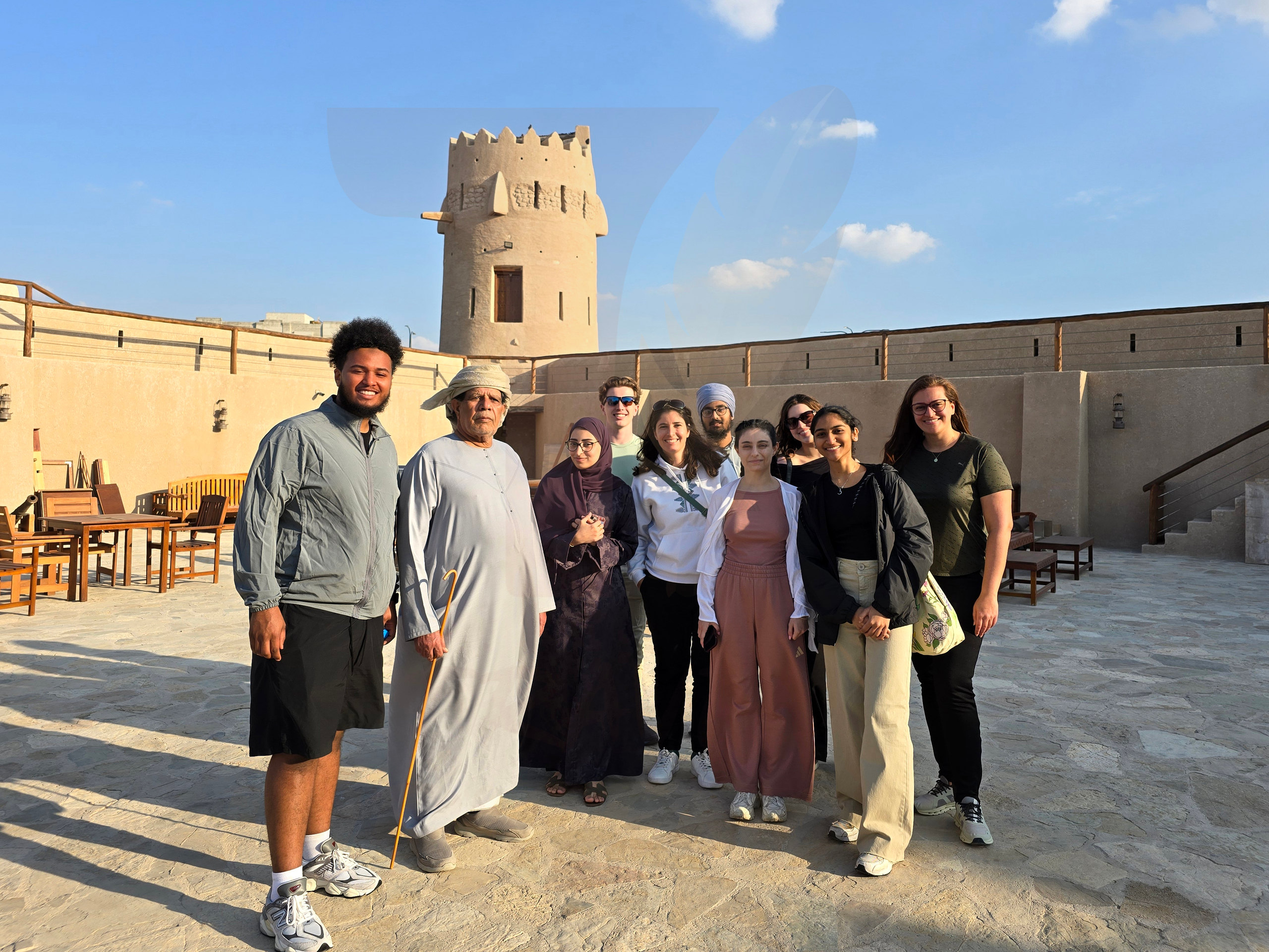 travellers with local host at heritage fort Travellers with their local host at a heritage fort